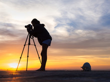 Silhouette Of Woman Shooting With Camera At Sunset,cat With Photographer