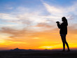 © max_play - Girl photographer with camera at sunset