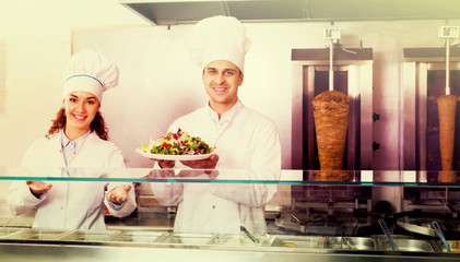 Staff posing at kebab counter