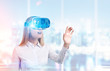 © ImageFlow - Businesswoman in vr glasses in office