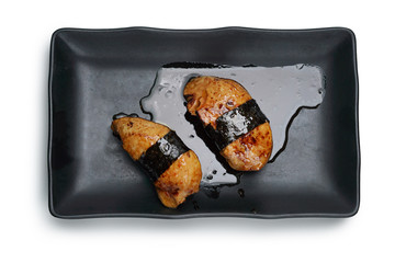 Close-up Foie Gras sushi in black plate, isolated on white background and selective focus, flat lay