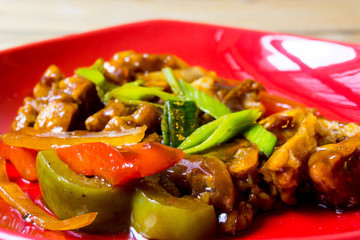 wok fried chicken stir fry with sweet peppers and chinese vegeta