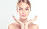 Fototapeta  - Beautiful Young Woman with clean fresh skin  . Facial  treatment   . Cosmetology , beauty  and spa .
