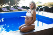 Young pregnant woman in swimming pool