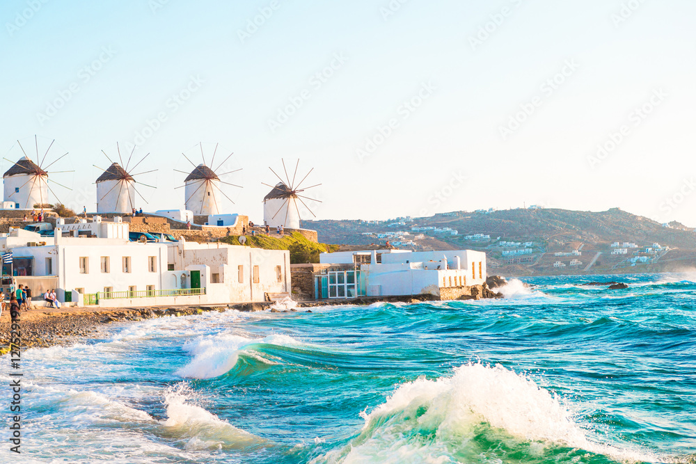 Famous view of traditional greek windmills on Mykonos island at sunrise, Cyclades, Greece - obrazy, fototapety, plakaty 