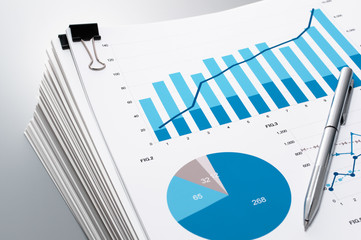 Poster - Close up of documents and charts.　Pile of documents and pen on gray reflection background.
