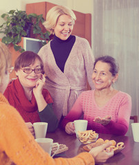 Wall Mural - Mature women drinking tea