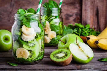 Wall Mural - ingredients for  smoothie in  jar: banana, kiwi, spinach, green apple