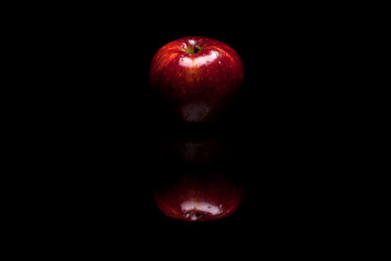 Red apple isolated on black background