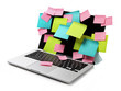 Image of laptop full of colorful sticky notes reminders on scree