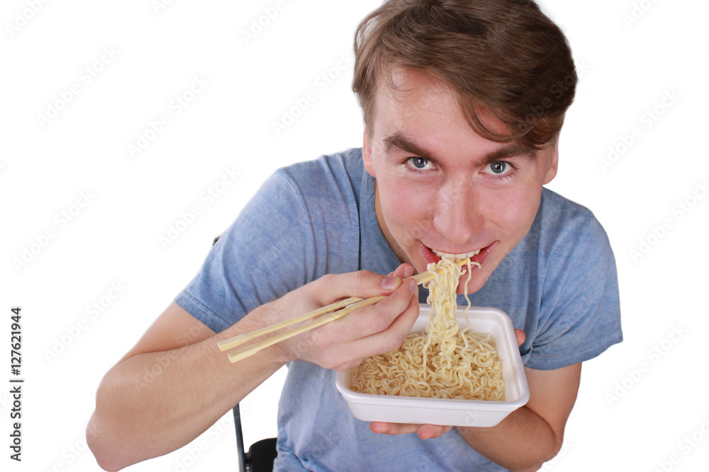 hungry happy man eating noodles with gusto Stock Photo | Adobe Stock