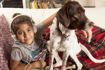 kid listenning music with pet