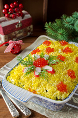 Salad with crab sticks and caviar. The salad on the holiday tabl