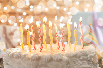 Poster - Lighted candles on birthday cake, closeup