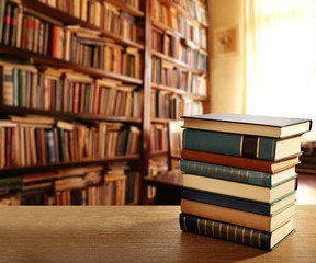 Sticker - Stack of books on table at library