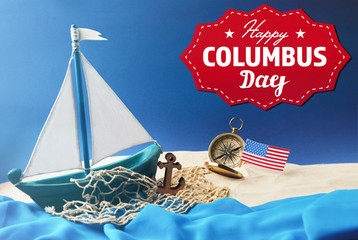 Wall Mural - Text HAPPY COLUMBUS DAY with wooden boat and net on blue background. National holiday concept.