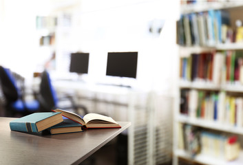 Poster - Books on table at library