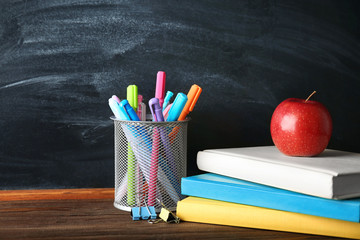 Sticker - Colorful school stationery on table on blackboard background