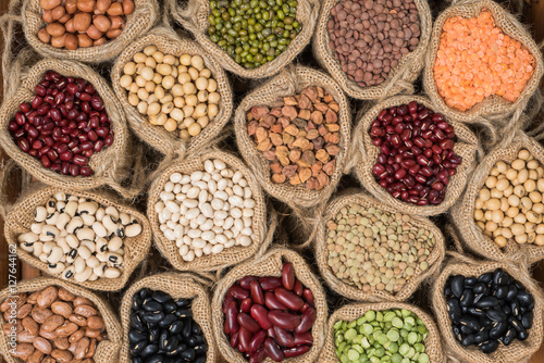 Fotografie, Obraz Various dry legumes in a sack cloth, Different dry legumes for background