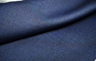close up roll texture blue fabric of suit