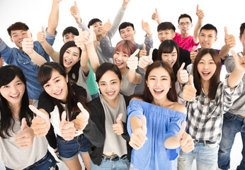 top view of happy young group with thumbs up