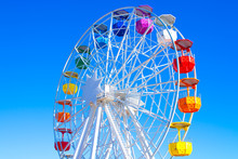 Multicolour Ferris Wheel On Blue Sky Background	