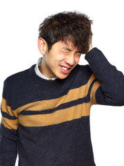 Closeup portrait, stressed young asian man, hands on head with b