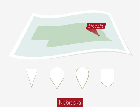 Curved paper map of Nebraska state with capital Lincoln on Gray Background. Four different Map pin set. Vector Illustration.