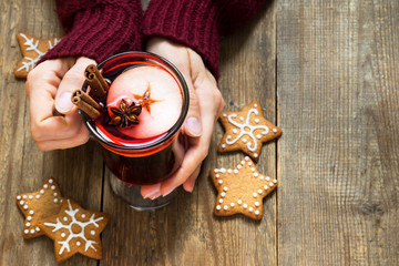 Christmas mulled wine in female hands