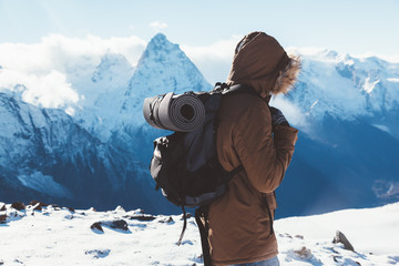 Wall Mural - Hiker in mountains in winter