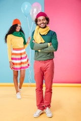 Wall Mural - Happy woman with balloons walking on date to her boyfriend