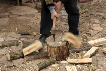 Man chopping fire wood with motion blur