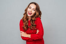 Cheerful Beautiful Young Woman In Red Sweater