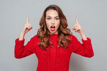 Canvas Print - woman in red sweater attracts attention