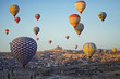 © natalia_maroz - Colorful hot air balloons flying over the valley at Cappadocia, Turkey. Volcanic mountains in Goreme national park