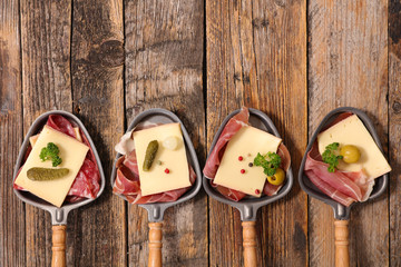 Wall Mural - raclette cheese and meats