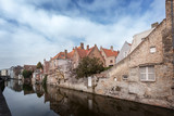 Fototapeta  - Beautiful houses along the canals of Brugge, Belgium. Tourism destination in Europe