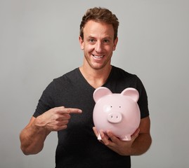 Poster - Smiling man with piggy bank.