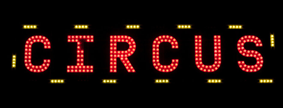 electric CIRCUS sign on a scaffolding in the night