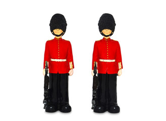 two Queen's guard statue in traditional uniform with weapon, British soldier, isolated on white background