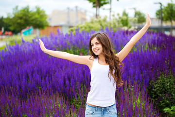 Wall Mural - Young laughing girl in the park.