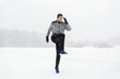 © Syda Productions - man exercising and warmig up in winter outdoors