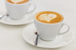 © alimyakubov - Cup of art latte or cappuccino coffee with retro filter effect