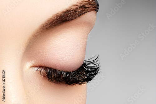 Fotomural Beautiful macro shot of female eye with extreme long eyelashes and black liner makeup