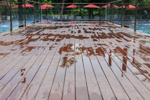 Wet Outdoor Decking Beside Swimming Pool After Raining