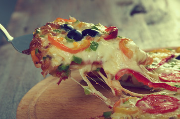 Canvas Print - taking slice of pizza,melted cheese dripping