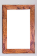 Wall Mural - Empty wooden frame hanging on the wall. Interior decoration