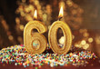 Birthday cake with burning candles on blurred background
