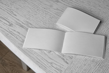 Canvas Print - Blank brochures on wooden table