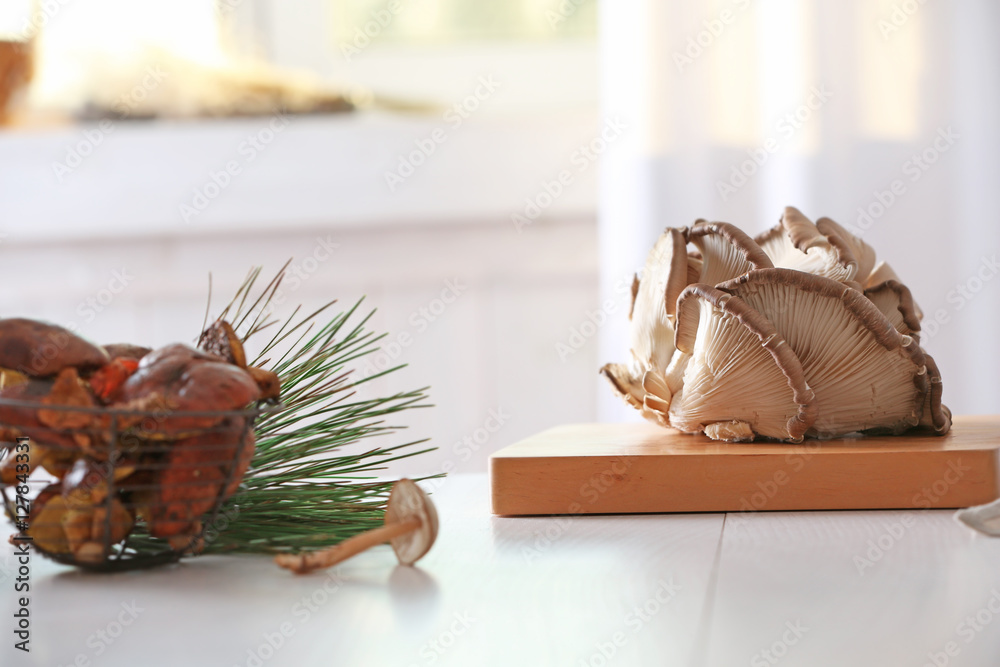 Fresh mushrooms on wooden cutting board